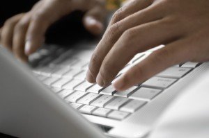 hands on computer keyboard Employment Discrimination Lawyer