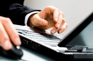 man on laptop Bronx Employment Lawyer